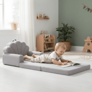 Enfant allongé lisant sur le canapé-lit enfant gris déplié - Jolly Mino